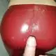 Cumshot on Red Leather Ass
